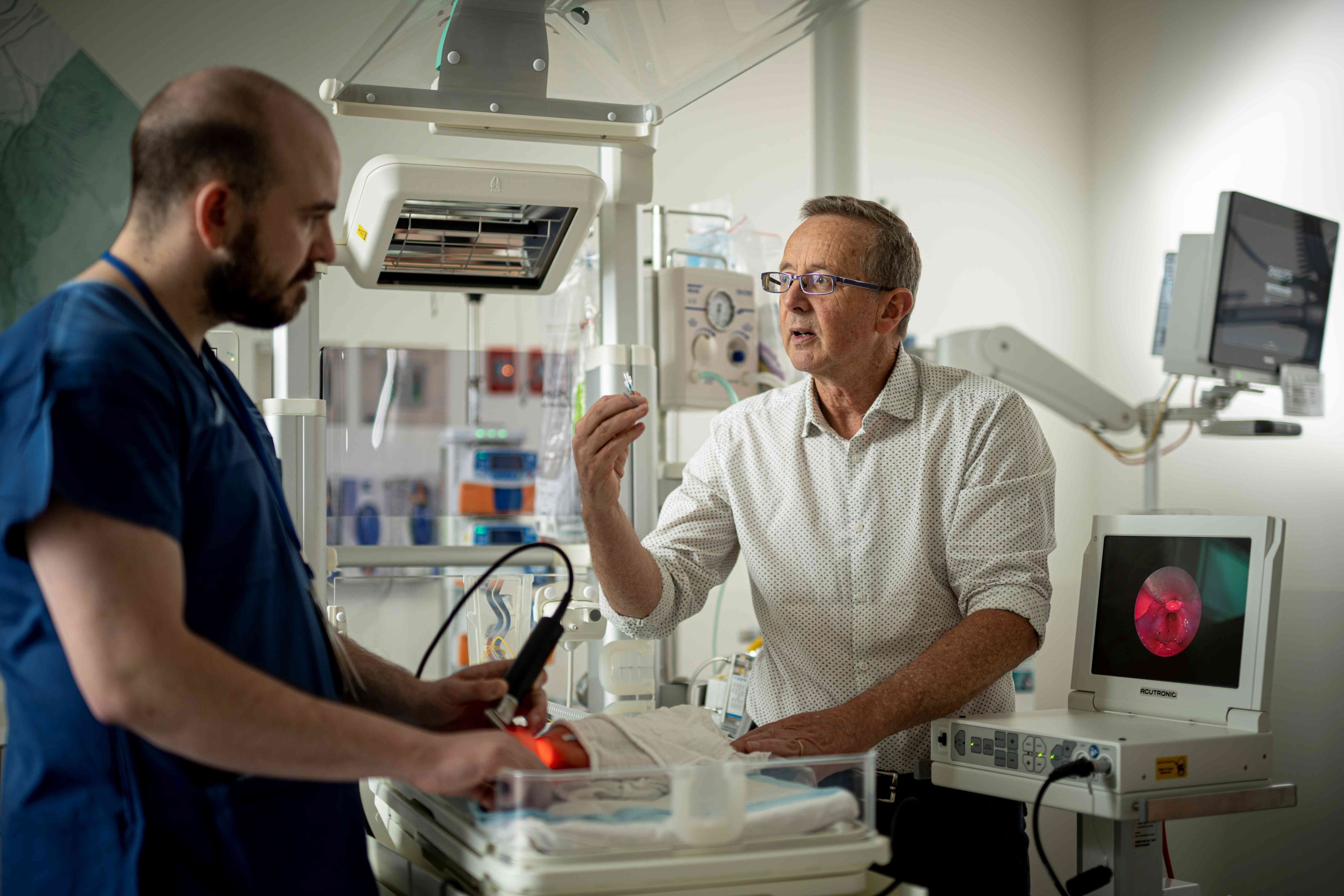 Professor Peter Dargaville trains Lewis Johnson in the Neonatal Intensive Care Unit at the RHH